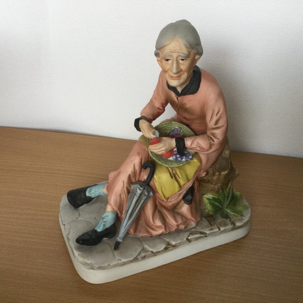 Vintage figurine sitting lady with fruits & umbrella marked made in Japan